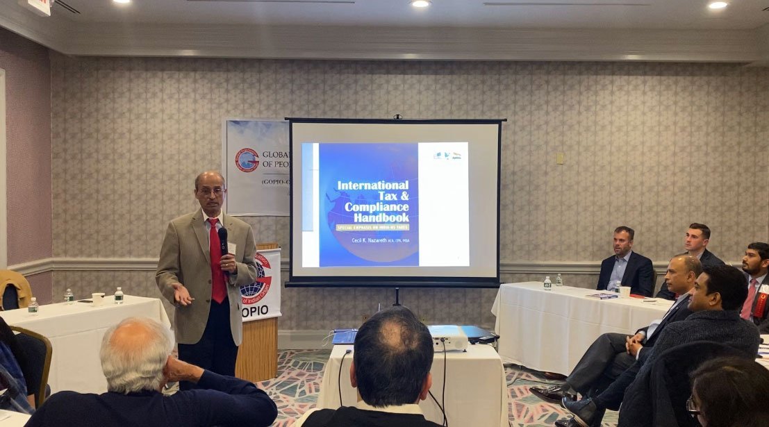 Cecil Nazareth speaking at a professional event